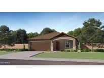 Charming one-story home with a well-maintained lawn, a 2-car garage, and desert landscaping in the front at 32243 N Garnet Way, San Tan Valley, AZ 85143