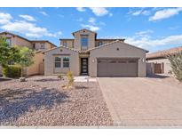 Charming home featuring a well-maintained desert landscape and a two-car garage at 3394 E Tiffany Ct, Gilbert, AZ 85298