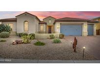 Charming single-story home featuring well-manicured desert landscaping and a three-car garage at 3753 E Ellis St, Mesa, AZ 85205