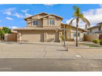 Inviting two-story home with a three-car garage, desert landscaping, and a basketball hoop at 4019 W Charlotte Dr, Glendale, AZ 85310