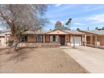 Charming single-story home with well-maintained front yard and attached garage in a quiet neighborhood at 5137 N 20Th Ave, Phoenix, AZ 85015