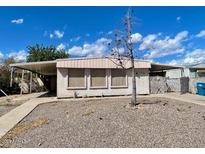 Cozy single-story home featuring front yard and covered parking at 7214 S 42Nd St, Phoenix, AZ 85042