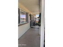 Inviting front porch with decorative security door and charming architectural details at 2137 W Del Campo Cir, Mesa, AZ 85202