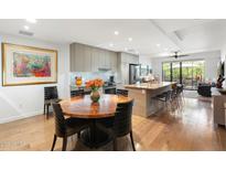 Bright, modern kitchen features stainless steel appliances and a large island with bar seating at 2300 E Campbell Ave # 104, Phoenix, AZ 85016