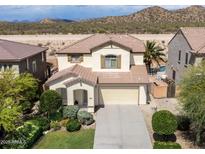 Charming two-story home featuring a desert landscaped yard and a two car garage at 29339 N 67Th Ave, Peoria, AZ 85383