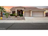 Charming home featuring a desert landscape, two-car garage, and tile roof against a beautiful sunset sky at 3256 E Maplewood St, Gilbert, AZ 85297