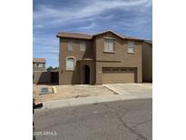 Charming two-story home featuring a two-car garage, low maintenance landscaping, and a tile roof at 3825 S 60 Dr, Phoenix, AZ 85043