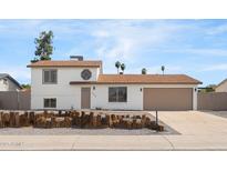 Inviting home with a well-maintained yard, neutral exterior, and attached two-car garage at 4629 E Southern Ave, Phoenix, AZ 85042