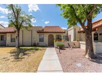 Charming single-story home with a tile roof, walkway, and a well-maintained gravel front yard at 5136 E Evergreen St # 1142, Mesa, AZ 85205