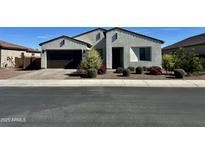 Charming single-story home with a well-manicured front yard and a two-car garage at 8024 W State Ave, Glendale, AZ 85303
