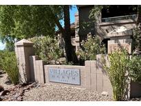 Villages North sign with address, 15225, surrounded by desert landscaping and multi-story condo buildings at 15225 N 100Th St # 1220, Scottsdale, AZ 85260