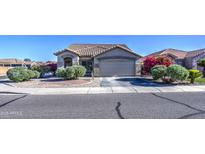Charming single-story home with desert landscaping and a tile roof under a clear blue sky at 3790 W White Canyon Rd, San Tan Valley, AZ 85144