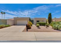 Charming single story home with desert landscaping, two car garage, and a private gated courtyard at 4317 E Glenrosa Ave, Phoenix, AZ 85018