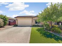 Charming single-story home features a well-maintained lawn and inviting curb appeal at 913 W Leadwood Ave, Queen Creek, AZ 85140