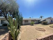 Charming single-story home with desert landscaping and brick accents at 1529 W Eva St, Phoenix, AZ 85021