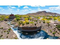 Picturesque Estrella community entrance with water features and desert landscaping creates a welcoming atmosphere at 16389 W Fawn Dr, Goodyear, AZ 85338