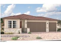 Charming single-story home featuring a two-car garage, landscaped front yard, and a stylish tiled roof at 18210 W Hess St, Goodyear, AZ 85338