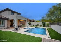 Inviting backyard pool area with manicured landscaping and outdoor seating at 18515 N 97Th Way, Scottsdale, AZ 85255