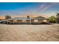 Charming single-story brick home with a well-maintained exterior and desert landscaping at 2024 N 200Th Ave, Buckeye, AZ 85396