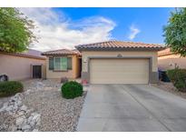 Charming single-story home with desert landscaping and a two-car garage at 2734 W Bowker St, Phoenix, AZ 85041