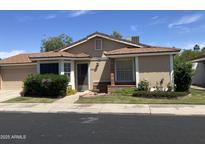 Inviting single-story home featuring a well-manicured lawn and classic architectural details at 314 E Campo Bello Dr, Phoenix, AZ 85022