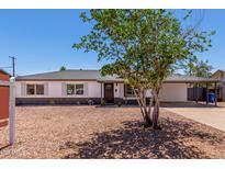 Charming single-story home featuring a low maintenance front yard and covered parking at 1539 W 5Th St, Tempe, AZ 85281