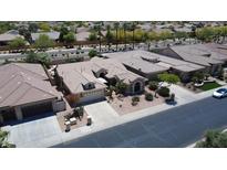 An aerial view of a single Gathering home that features a landscaped front yard and an attached two-car garage at 16083 W Cambridge Ave, Goodyear, AZ 85395