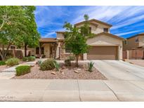 Charming two-story home with well-maintained landscaping and an attached two-car garage at 42711 N 45Th Dr, Phoenix, AZ 85087