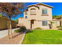Charming two-story home with a well-maintained lawn and appealing curb appeal at 546 E San Carlos Way, Chandler, AZ 85249