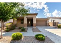 Inviting single-story home featuring a well-maintained front yard and a welcoming covered porch at 23195 S 226Th Way, Queen Creek, AZ 85142