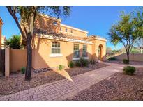 Charming stucco home featuring a tile roof, paver walkway, and mature landscaping at 2994 E Megan St, Gilbert, AZ 85295