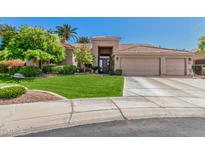 Charming single-story home featuring a three-car garage, mature landscaping, and inviting curb appeal at 9571 N 117Th St, Scottsdale, AZ 85259