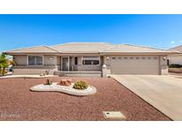 Charming single-story home with desert landscaping, a two-car garage, and a neutral color palette at 11510 E Lomita Ave, Mesa, AZ 85209
