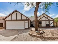 Charming home with white and brown trim, two-car garage, and desert landscaping at 20626 N 5Th Ave, Phoenix, AZ 85027