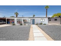 Charming single-story home with xeriscaped yard and a walkway leading to the front door at 2320 E Mulberry Dr, Phoenix, AZ 85016