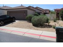 Charming single-level home with a two-car garage and desert landscaping at 3237 E Fremont Rd, Phoenix, AZ 85042