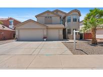 Charming two-story home with a three-car garage and well-maintained landscaping at 43507 W Cydnee Dr, Maricopa, AZ 85138
