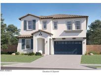 Charming two-story home with a Spanish-style elevation, blue shutters, and a two-car garage at 8331 E Petunia Ave, Mesa, AZ 85212