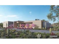 Contemporary home with desert landscaping, pink flowering bushes, and covered entry at 9828 E Running Deer Trl, Scottsdale, AZ 85262