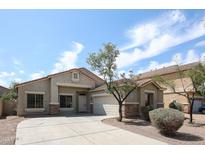 Charming single-story home featuring a desert landscaped front yard and a two-car garage, perfect for suburban living at 14262 N 142Nd Ln, Surprise, AZ 85379