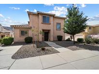 Charming two-story home with desert landscaping and a welcoming walkway to the front door at 26408 N 53Rd Gln, Phoenix, AZ 85083