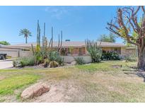 Charming single-story home boasting desert landscaping, offering curb appeal and low maintenance at 323 E Griswold Rd, Phoenix, AZ 85020