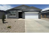 Charming single-story home featuring a well-maintained yard and an attached two-car garage at 46922 W Coe St, Maricopa, AZ 85139