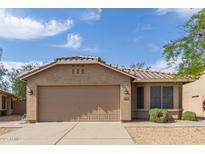 Charming single-story home featuring a tile roof, two-car garage and landscaped front yard at 5336 W Campo Bello Dr, Glendale, AZ 85308