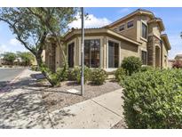 Charming home exterior featuring a tiled roof, manicured landscaping, and a welcoming front yard at 5415 E Mckellips Rd # 100, Mesa, AZ 85215