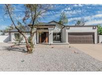 Charming single story home featuring a two-car garage and a well kept xeriscape front yard at 6701 W Monterey Way, Phoenix, AZ 85033