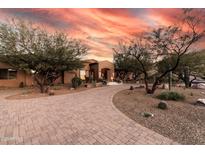 Expansive property featuring mature desert landscaping and a circular paved driveway at 14760 E Paradise Dr, Fountain Hills, AZ 85268