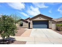 Charming single-story home with a well-maintained yard and attached two-car garage at 16418 W Whitehorn Way, Surprise, AZ 85387