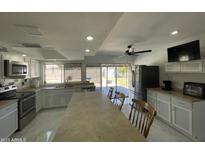 Bright, open kitchen with stainless steel appliances and a large island perfect for entertaining at 3738 W Danbury Dr, Glendale, AZ 85308