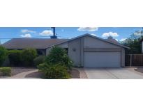 Charming single-story home with desert landscaping, a two-car garage, and neutral color palette at 10201 S 49Th St, Phoenix, AZ 85044